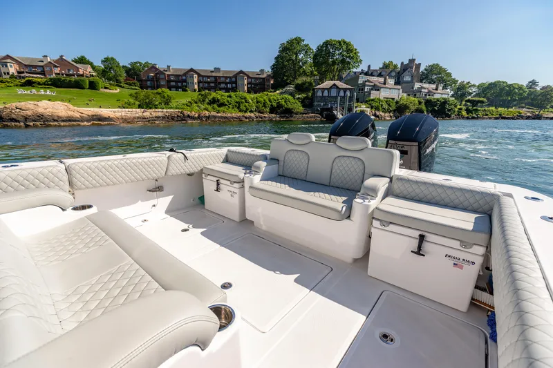 Slide: The Image of 2024 HCB 39 Speciale boat interior with luxurious seating and scenic waterfront view. - 25