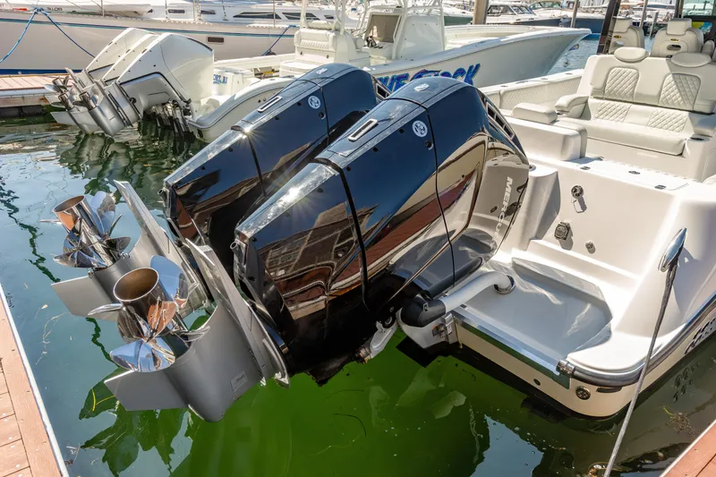 Slide: The Image of 2024 HCB 39 Speciale boat with dual outboard engines docked. - 35
