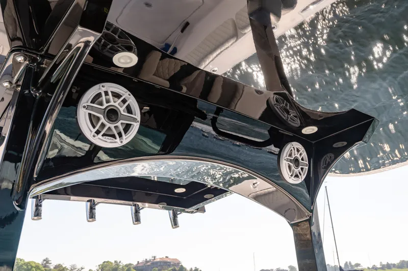 Slide: The Image of 2024 HCB 39 Speciale boat with sleek black design and built-in speakers. - 38