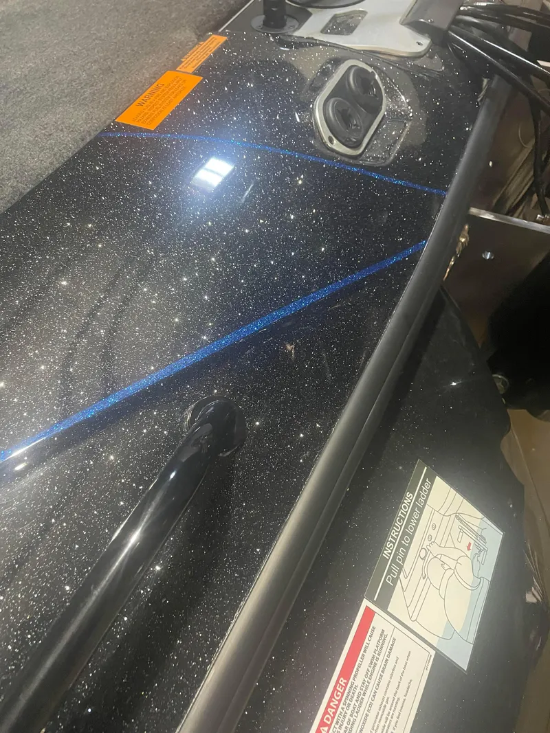 Slide: The Image of 2025 Skeeter FXRL21 boat dashboard with control panel and safety instructions. - 6