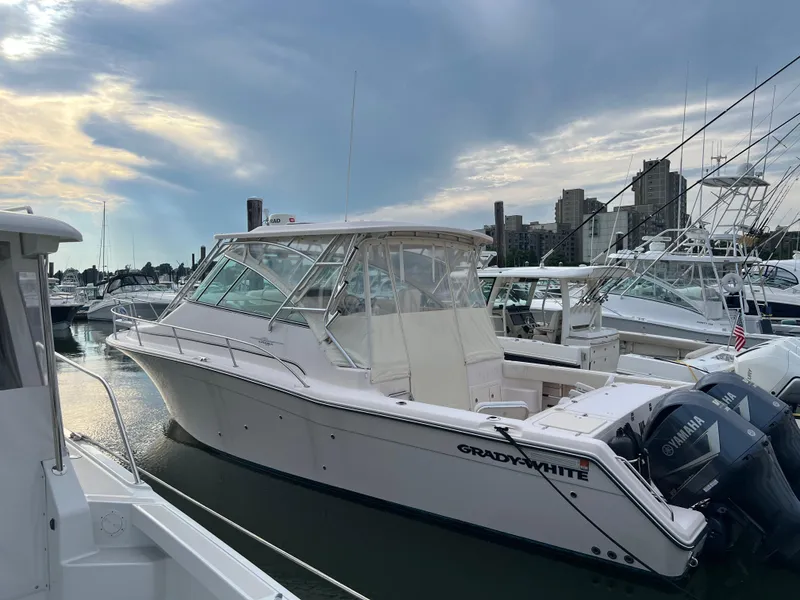Slide: The Image of 2008 Grady-White Express 360 boat docked at a marina. - 3