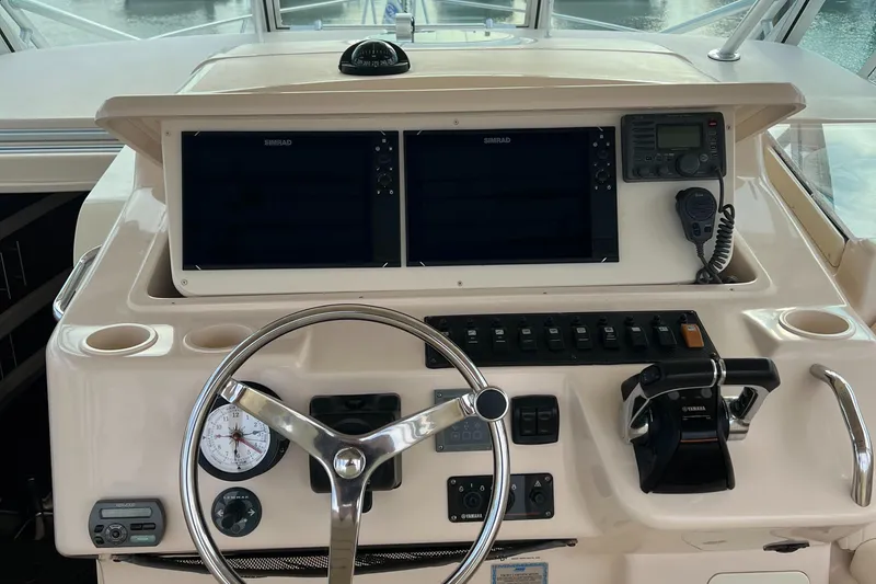 Slide: The Image of 2008 Grady-White Express 360 helm with dual displays and navigation controls. - 7