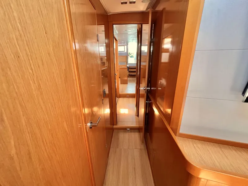 Slide: The Image of Interior hallway of 2012 Beneteau Sense 50 yacht with wooden finish. - 14