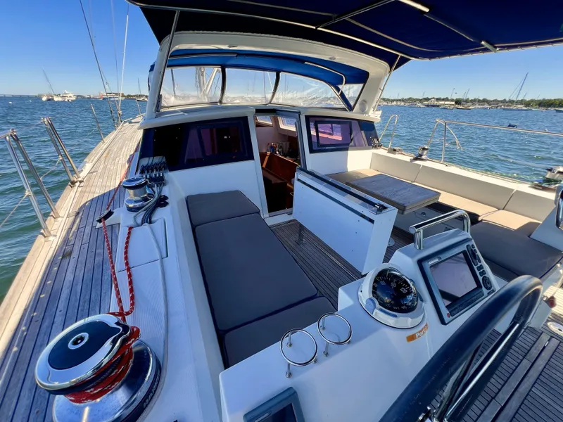 Slide: The Image of 2012 Beneteau Sense 50 sailboat cockpit with navigation equipment and seating. - 17