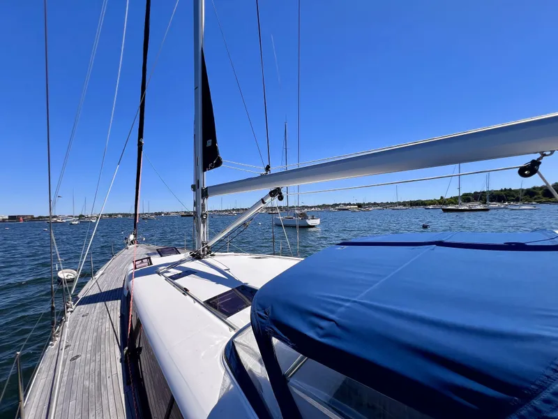 Slide: The Image of 2012 Beneteau Sense 50 sailboat on calm waters with clear blue sky. - 20