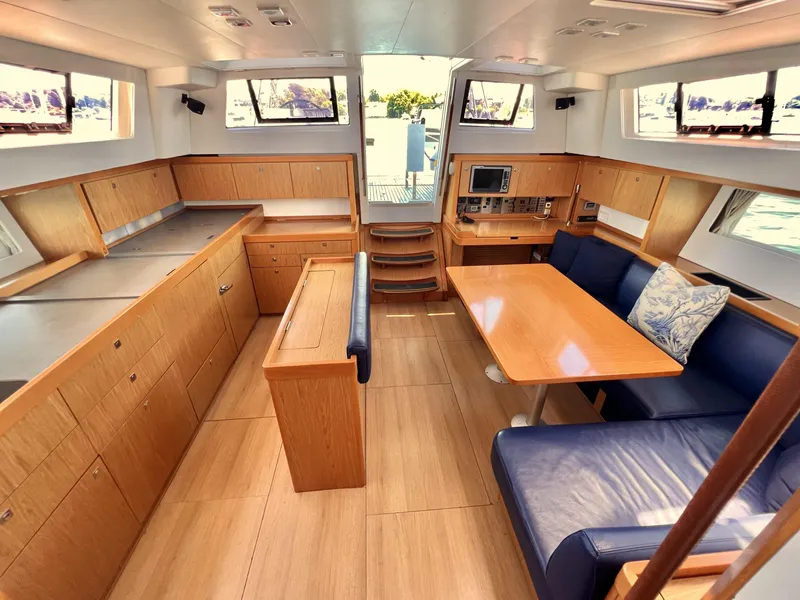 Slide: The Image of Spacious interior of 2012 Beneteau Sense 50 yacht with modern kitchen and dining area. - 6