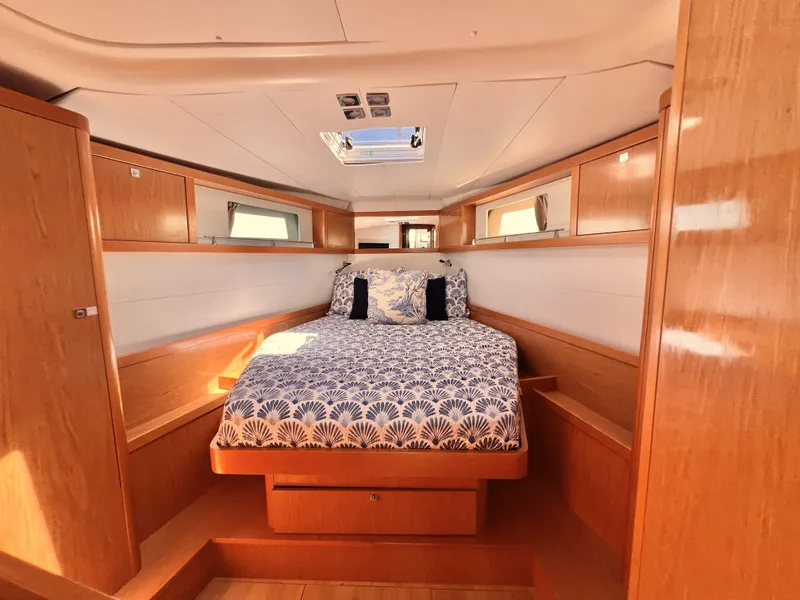 Slide: The Image of Interior cabin of 2012 Beneteau Sense 50 yacht with bed and wooden furnishings. - 7