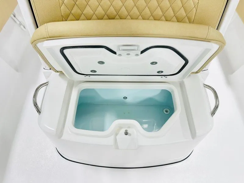 Slide: The Image of 2024 Sportsman MASTERS 247 BAY boat livewell with open lid and cushioned seat. - 10