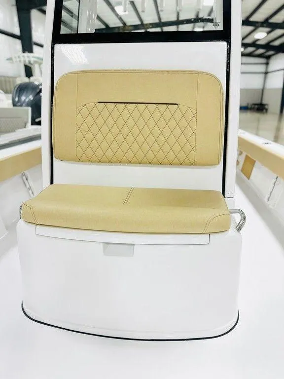 Slide: The Image of 2024 Sportsman MASTERS 247 BAY boat with tan cushioned seating. - 11