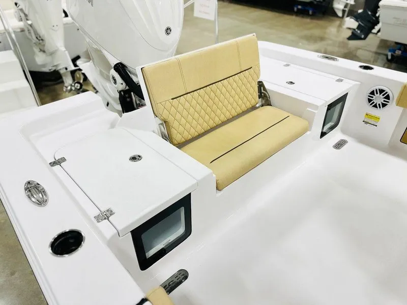 Slide: The Image of 2024 Sportsman MASTERS 247 BAY boat with tan seating and storage compartments. - 12