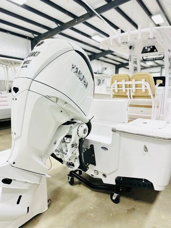 Slide: The Image of 2024 Sportsman MASTERS 247 BAY boat with powerful outboard motor in showroom. - 17