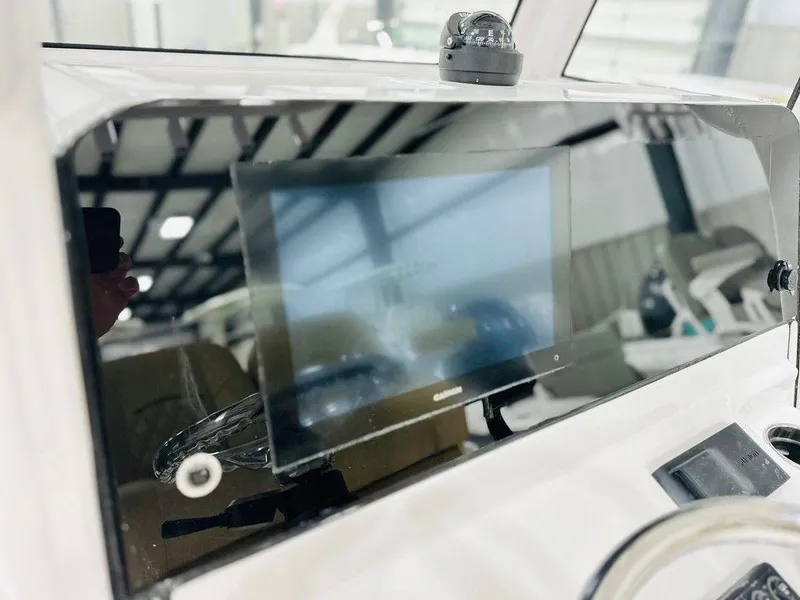 Slide: The Image of 2024 Sportsman MASTERS 247 BAY boat dashboard with navigation screen. - 4