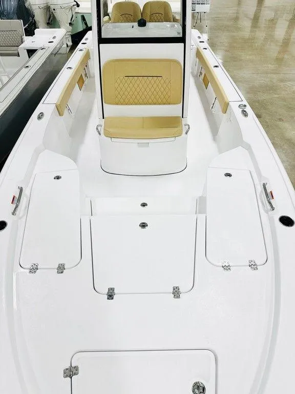 Slide: The Image of 2024 Sportsman MASTERS 247 BAY boat interior with seating and storage compartments. - 9
