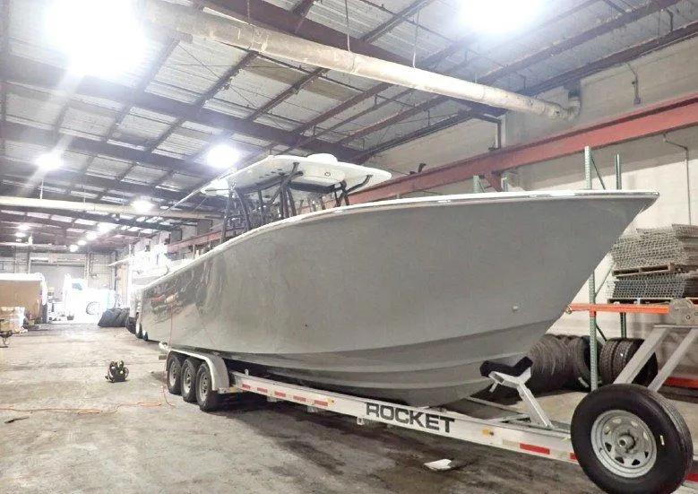 The Image of 2022 SeaHunter 35 Tournament boat on a trailer in a warehouse. - 0