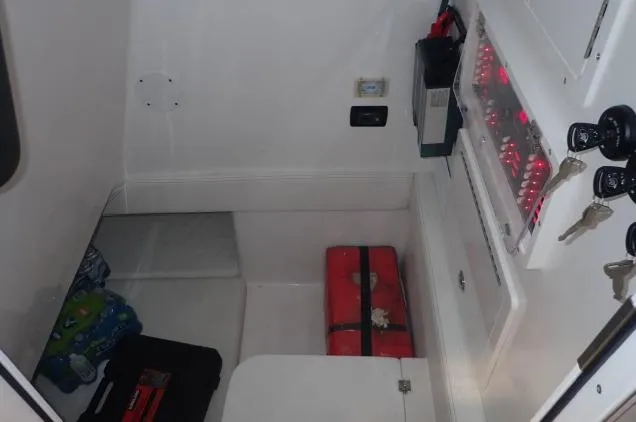Slide: The Image of Interior cabin of 2022 SeaHunter 35 Tournament boat with storage and electrical panel. - 8