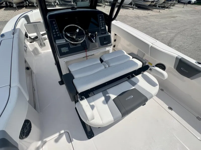 Slide: The Image of 2025 Robalo R250 boat interior with helm, seating, and control panel. - 11