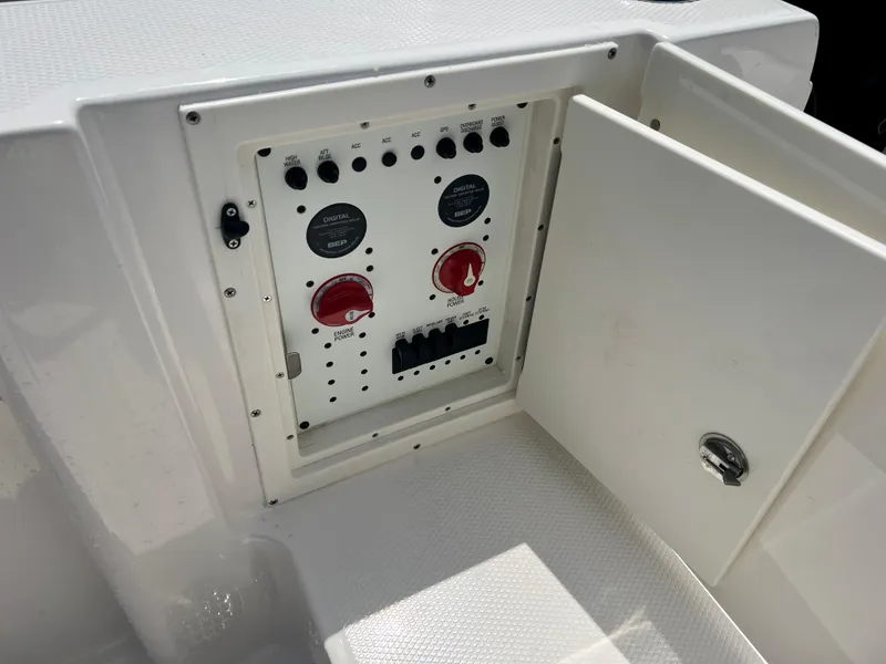Slide: The Image of Control panel of a 2025 Robalo R250 boat with open access door. - 16