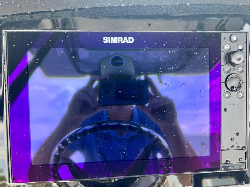 Slide: The Image of Simrad display on 2025 Robalo R250 boat with water droplets. - 20