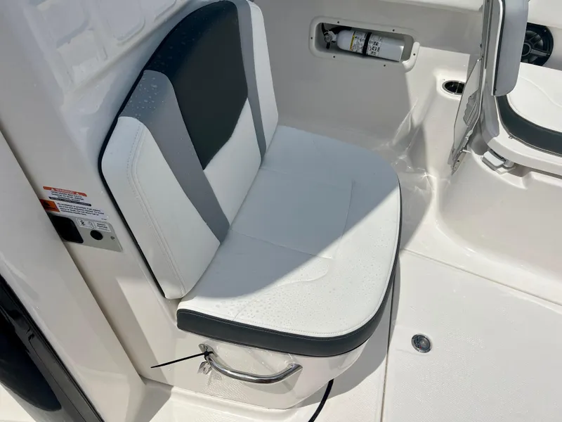 Slide: The Image of 2025 Robalo R250 boat seat with white and gray upholstery. - 24