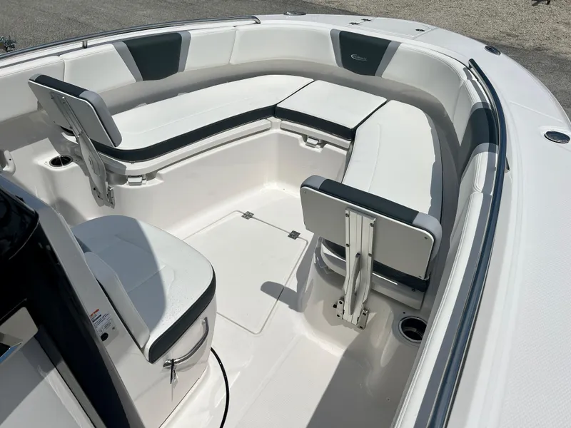 Slide: The Image of 2025 Robalo R250 boat interior with white and black seating. - 25