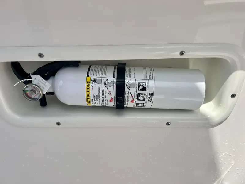 Slide: The Image of Fire extinguisher mounted on a 2025 Robalo R250 boat. - 27