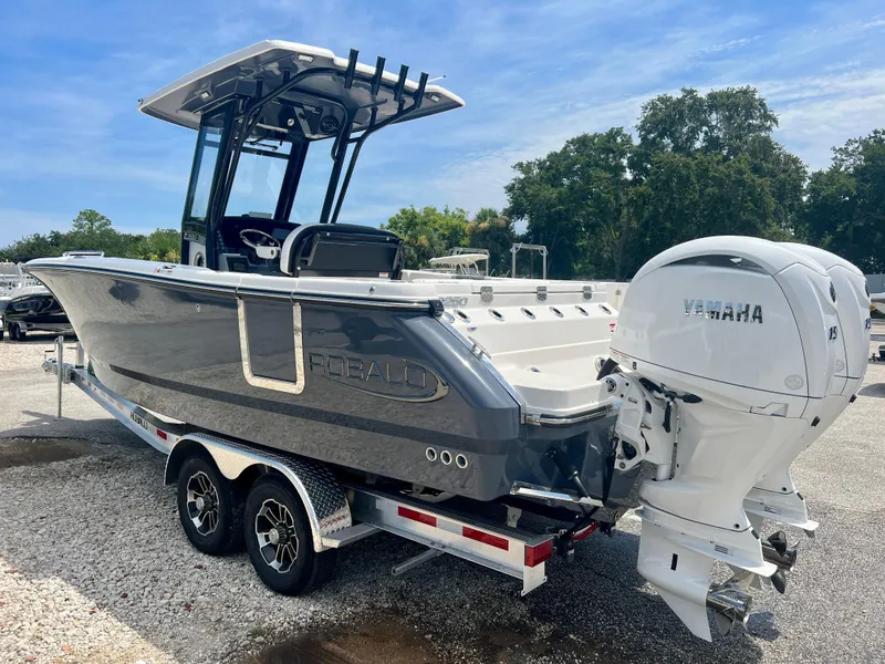 Slide: The Image of 2025 Robalo R250 boat with dual Yamaha engines on a trailer. - 5