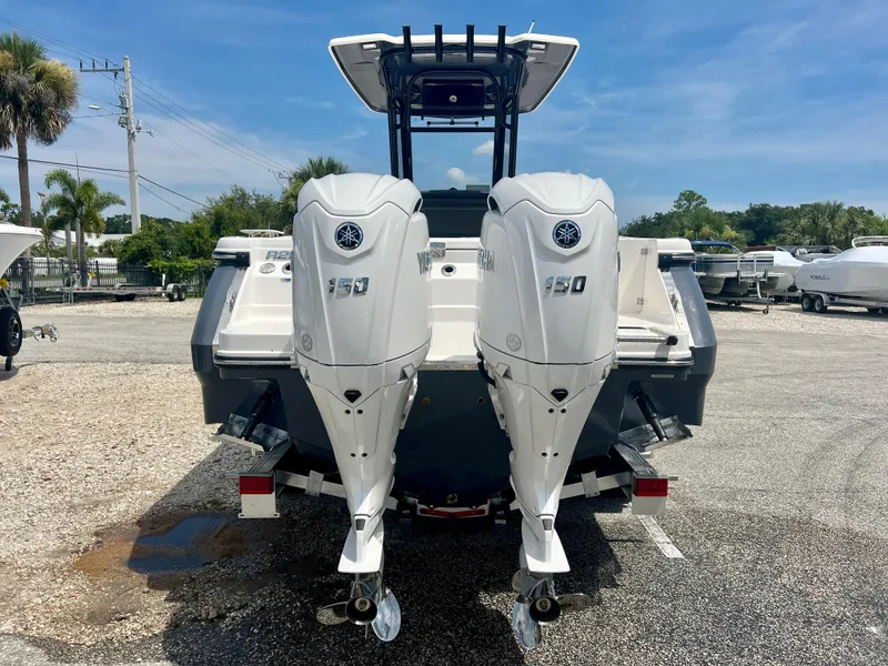 Slide: The Image of 2025 Robalo R250 boat with twin Yamaha 150 outboard engines. - 6