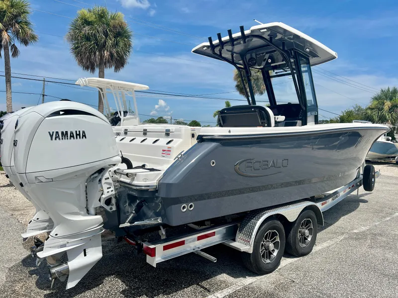 Slide: The Image of 2025 Robalo R250 boat with Yamaha outboard engines on a trailer. - 7