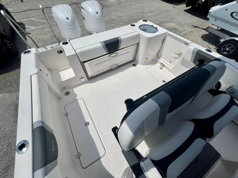 Slide: The Image of 2025 Robalo R250 boat interior with dual engines and seating area. - 9