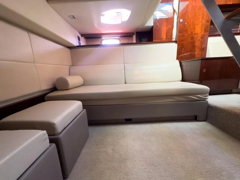 Slide: The Image of Luxurious interior of 2010 Sea Ray 450 Sundancer yacht with beige seating. - 12