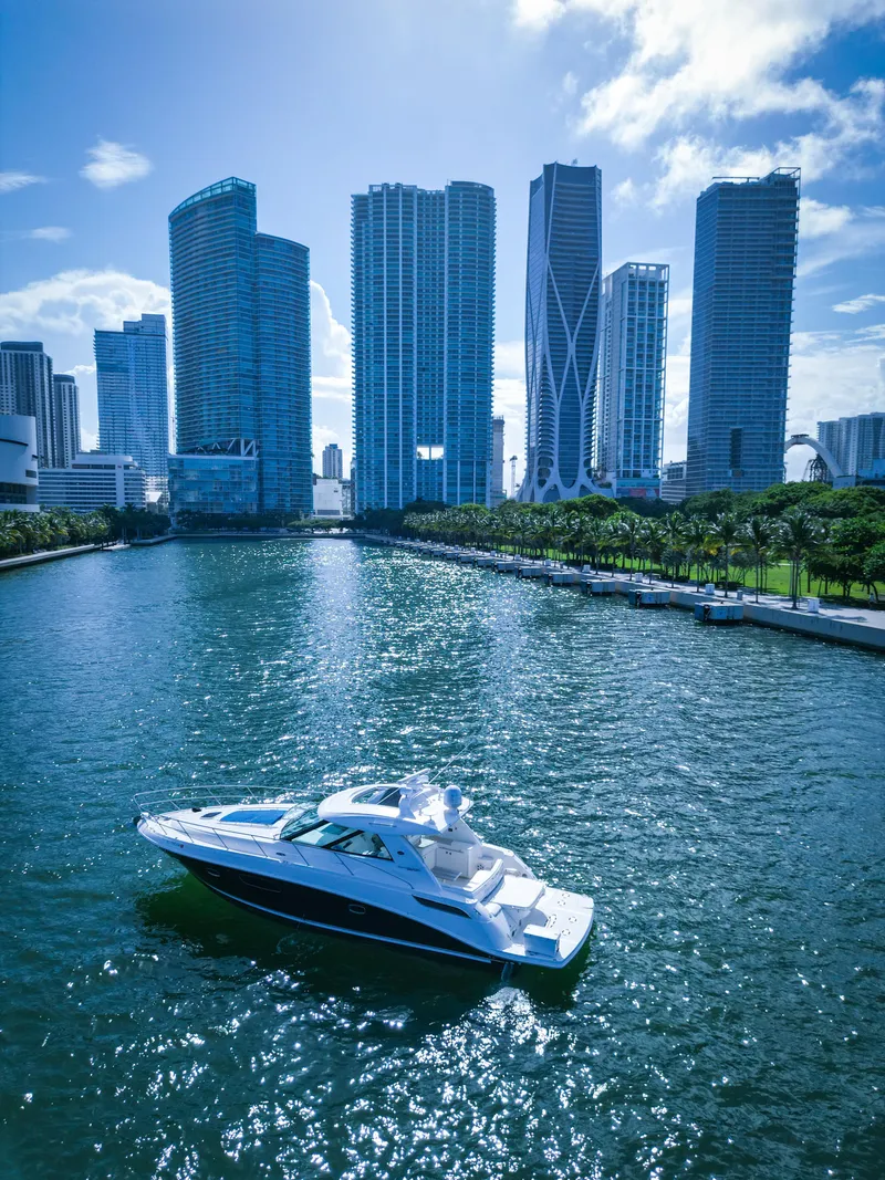 Slide: The Image of Sea Ray 450 Sundancer 2010 yacht cruising near city skyscrapers. - 2