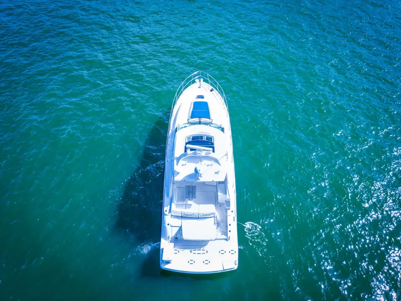 Slide: The Image of Aerial view of a 2010 Sea Ray 450 Sundancer yacht on blue water. - 3