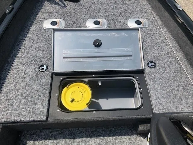 Slide: The Image of 2025 Tracker Pro Team 175 Crappie Edition boat storage compartment with rod holders. - 11