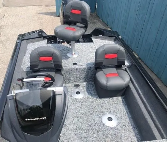 Slide: The Image of 2025 Tracker Pro Team 175 Crappie Edition fishing boat with gray and red seats. - 12