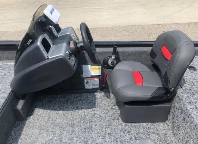 Slide: The Image of 2025 Tracker Pro Team 175 Crappie Edition boat interior with steering console and seating. - 17