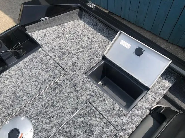 Slide: The Image of 2025 Tracker Pro Team 175 Crappie Edition boat interior with storage compartment. - 23