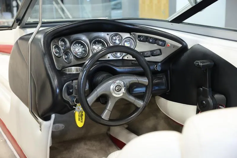 Slide: The Image of 2007 Crownline 23 SS boat dashboard and steering wheel. - 11