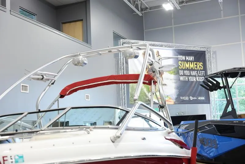 Slide: The Image of 2007 Crownline 23 SS boat on display in a showroom. - 7