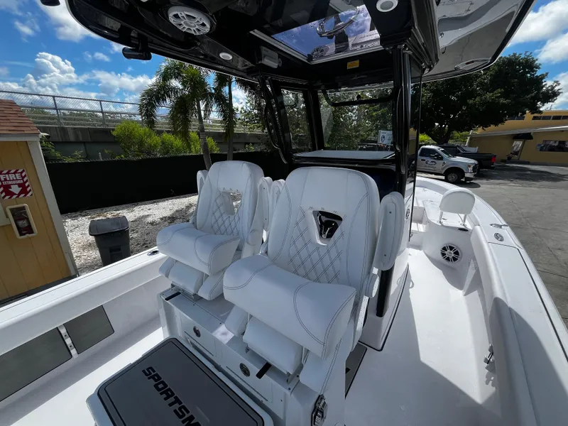 Slide: The Image of 2024 Sportsman Masters 267 Bay Boat with luxurious seating and modern design. - 16