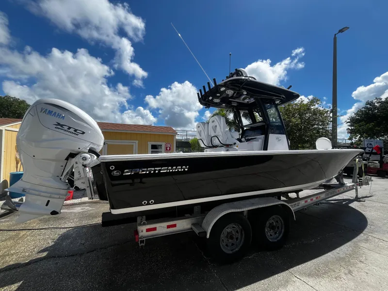 Slide: The Image of 2024 Sportsman Masters 267 Bay Boat on trailer with Yamaha engine. - 2
