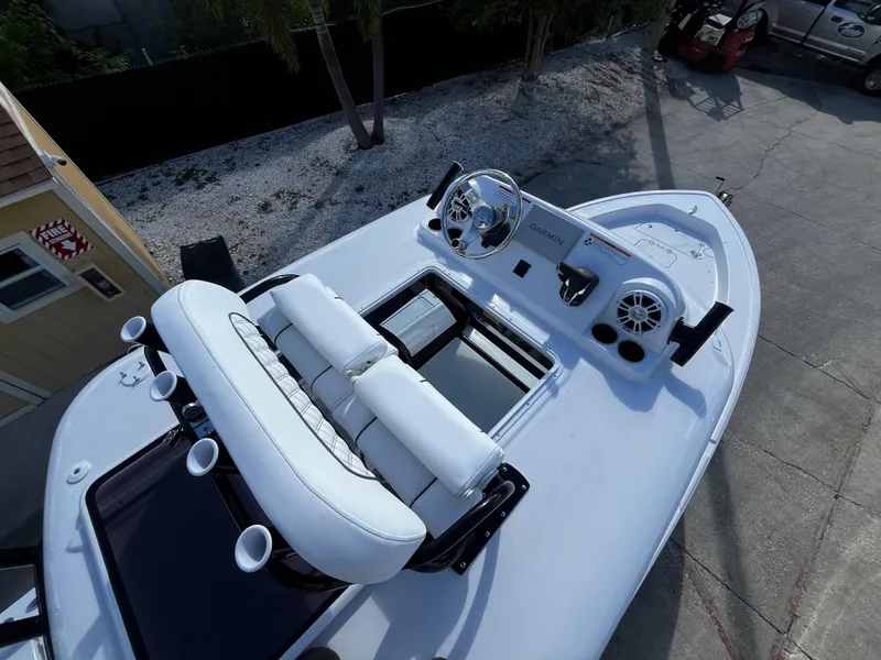 Slide: The Image of 2024 Sportsman Masters 267 Bay Boat with white seating and modern dashboard. - 20