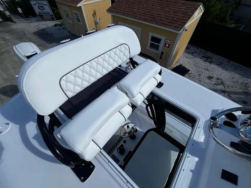 Slide: The Image of 2024 Sportsman Masters 267 Bay Boat helm seating and console. - 22