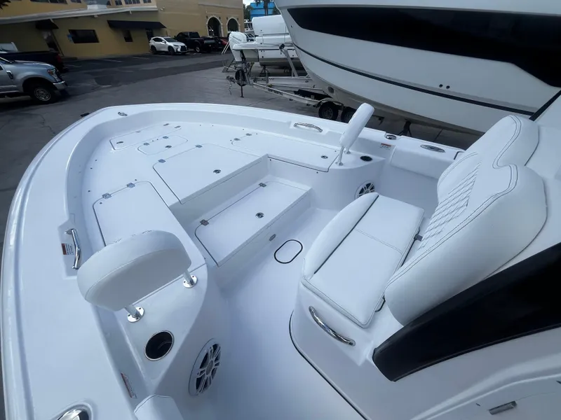 Slide: The Image of 2024 Sportsman Masters 267 Bay Boat with white interior and seating. - 29