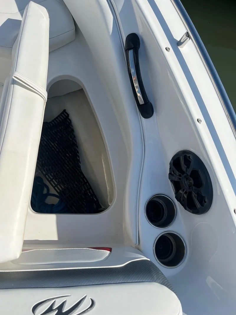 Slide: The Image of Interior of a 2015 Monterey 204FS boat with cup holders and speaker. - 12
