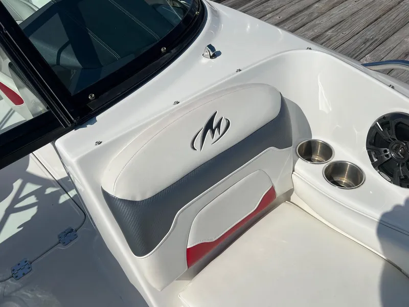 Slide: The Image of 2015 Monterey 204FS boat interior with logo, cup holders, and speaker. - 13