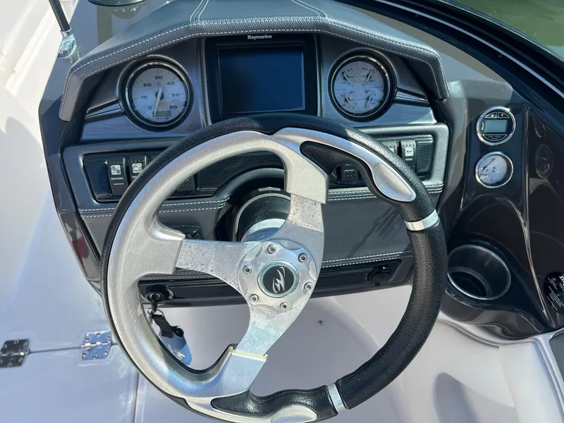 Slide: The Image of Steering wheel and dashboard of a 2015 Monterey 204FS boat. - 8