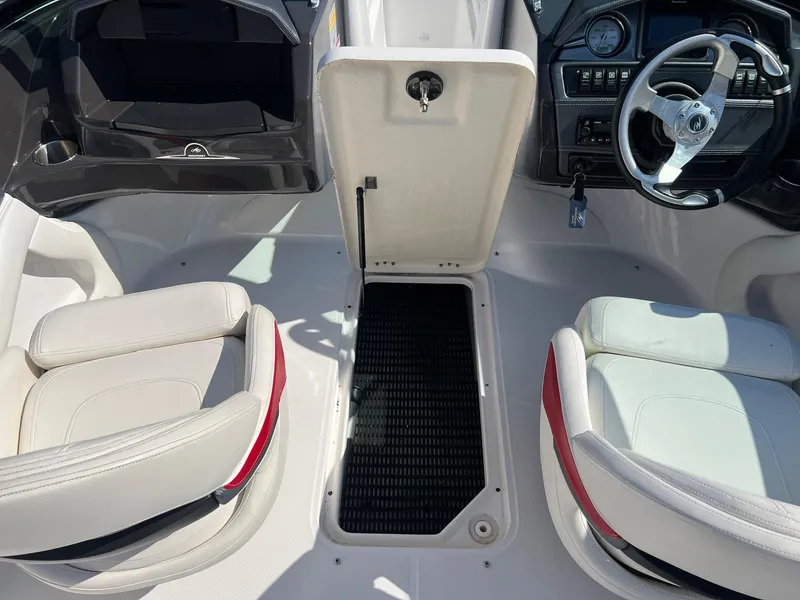 Slide: The Image of Interior of a 2015 Monterey 204FS boat with open storage compartment. - 9