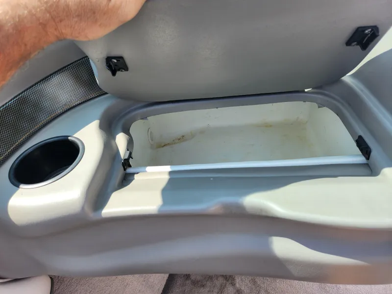 Slide: The Image of Open storage compartment in a 2000 Crownline 192 BR boat. - 14