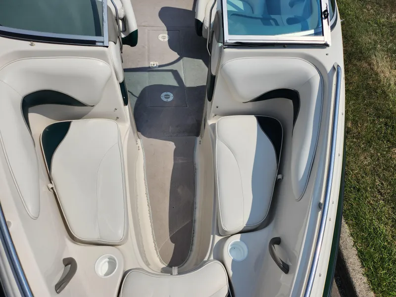 Slide: The Image of Interior of a 2000 Crownline 192 BR boat with white and gray seating. - 17