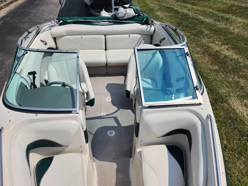 Slide: The Image of 2000 Crownline 192 BR boat interior with white and green seating. - 18